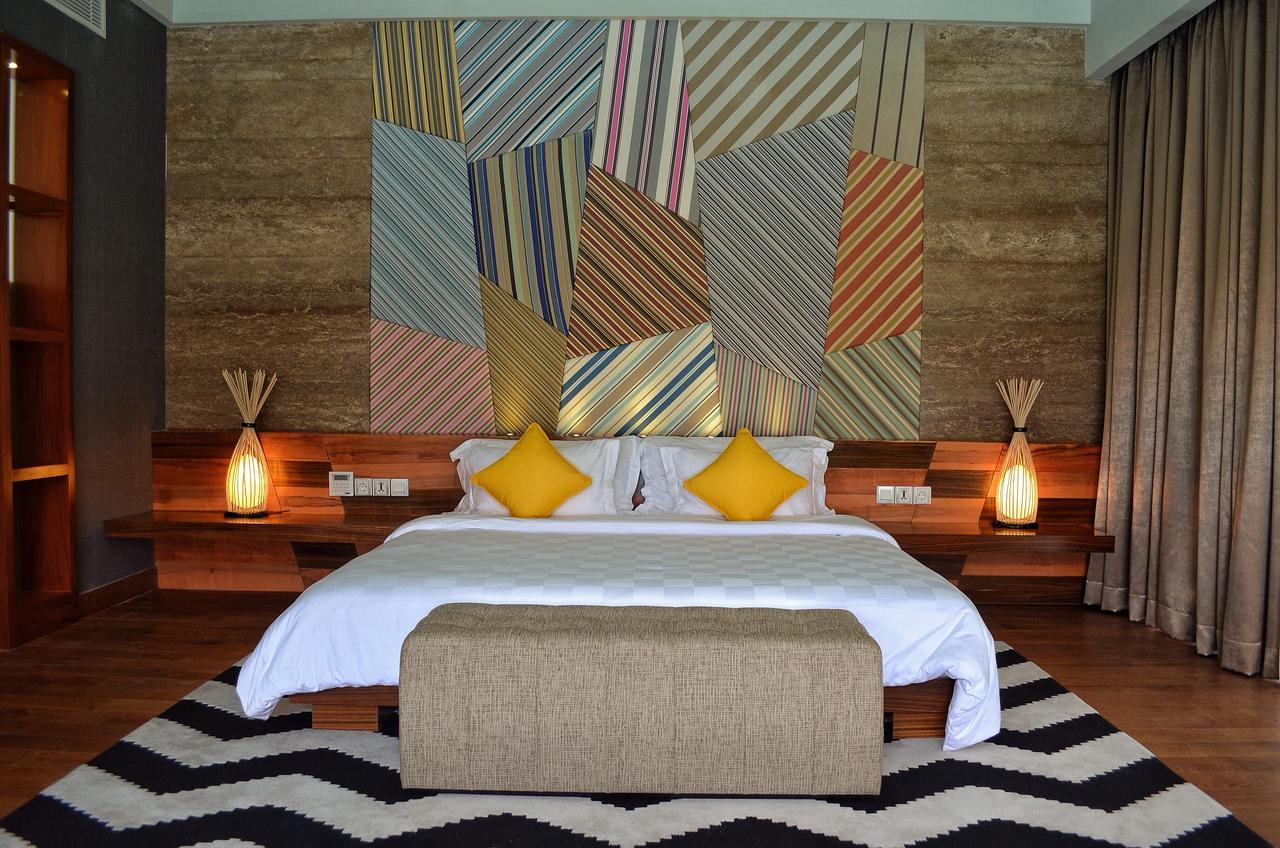 Ts Suites Seminyak Exterior foto A bedroom at the resort